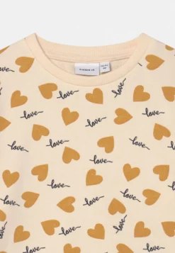 NAME IT Nmfkristina Light- Sweater - Buttercream -NAME IT Winkel d5d87064f79c492297ce9b6910ab2bee scaled